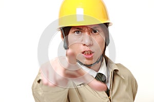 Young Japanese construction worker scolding