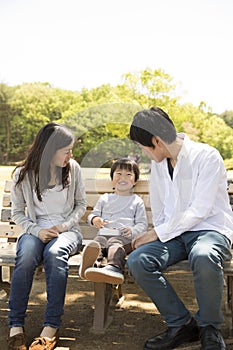 Young Japanese family enjoying in the park