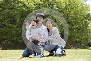 Young Japanese family enjoying in the park