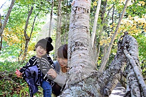 Young japanese mother is playing with her son