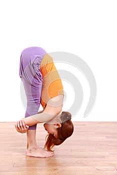 Young Japanese Woman Doing YOGA standing forward bend