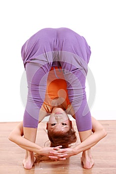 Young Japanese Woman Doing YOGA standing forward bend