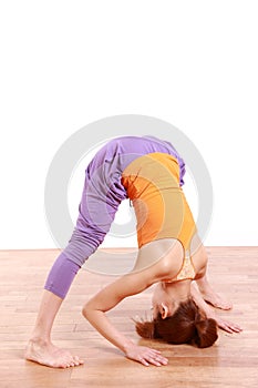 Young Japanese Woman Doing YOGA wide legged forward bend pose