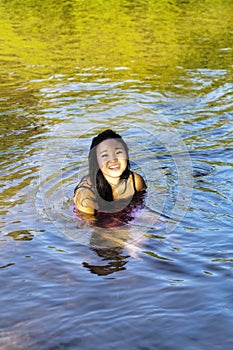 Young Japanese Woman Sitting River Dress Smiling