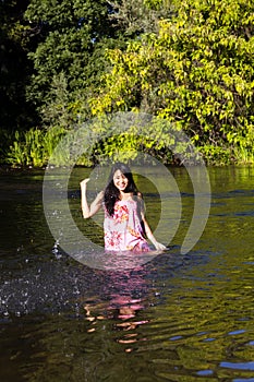 Young Japanese Woman Splashing River Dress Smiling