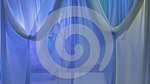 A young Jewish bride dances in front of a chuppah on the eve of the wedding