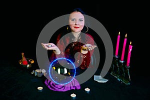 A young Jewish clairvoyant works about candles on the palms.