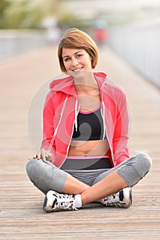 Young jogger woman relaxing after running