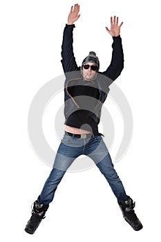 Young joyful man in winter wear jumping