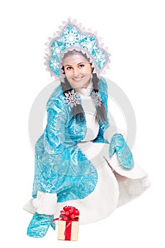 Young joyful woman posing in winter costume