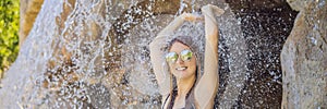 Young joyful woman under the water stream, pool, day spa, hot springs BANNER, LONG FORMAT