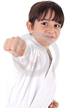 Young karate boy giving punch