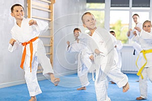 Young karate students gather in dojo