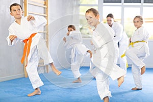 Young karate students gather in dojo