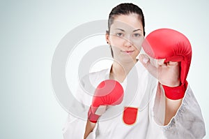 Young karate woman with glowes