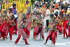 Young Kavadi Dancers move through the streets of Kandy during the Day Perahera in Sri Lanka.