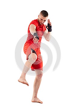 Young kickbox fighter on white