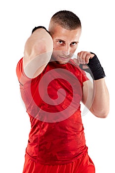 Young kickbox fighter on white