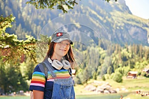 Young kid girl hiking in mountains