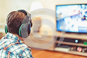 Young kid playing mass multiplayer game online