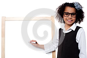 Young kid about to write on whiteboard