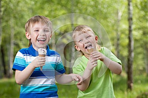 Young kids eating a tasty ice cream outdoor