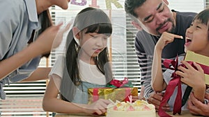 Young kids are surprised by a birthday party and celebrate with family together.