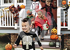 Young kids trick or treating during Halloween photo