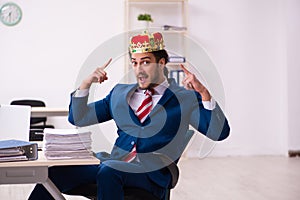 Young king businessman employee working in the office