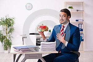 Young king businessman employee working in the office