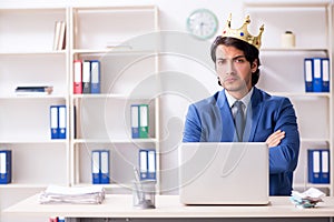 Young king businessman working in the office