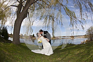 Young kissing couple on their wedding day