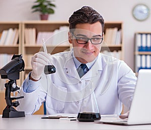 Young lab assistan working in the laboratory