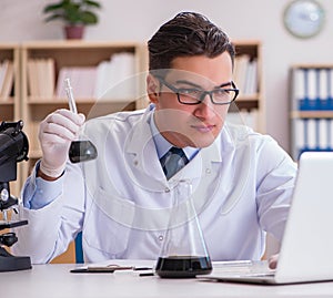 Young lab assistan working in the laboratory