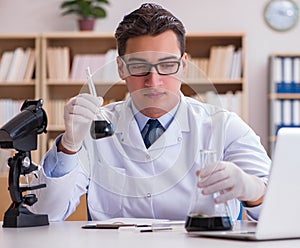 Young lab assistan working in the laboratory