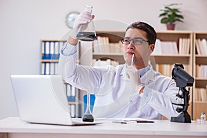 The young lab assistan working in the laboratory