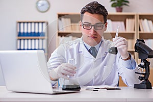 The young lab assistan working in the laboratory