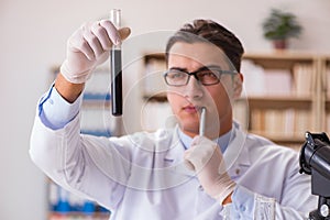 The young lab assistan working in the laboratory