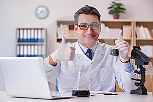 The young lab assistan working in the laboratory