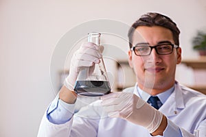 The young lab assistan working in the laboratory