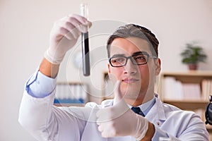 The young lab assistan working in the laboratory