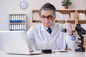 The young lab assistan working in the laboratory