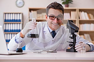 The young lab assistan working in the laboratory