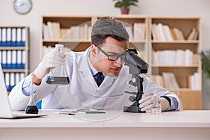 The young lab assistan working in the laboratory