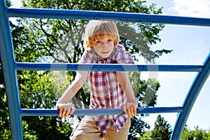 Young lad climbing on playground