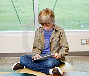 Young lad enjoying tablet