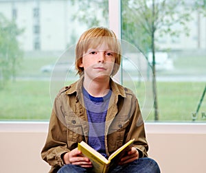 Young lad reading book photo