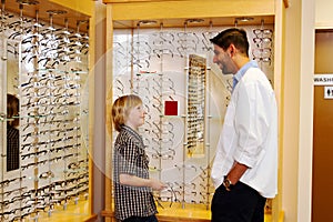 Young lad talking with optometrist