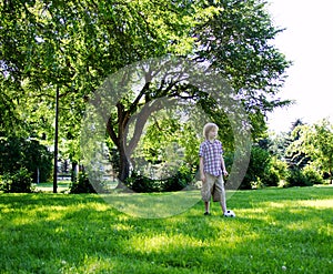 Young lad about to kick soccer ball photo