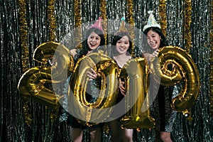 Young ladies celebrating new year countdown